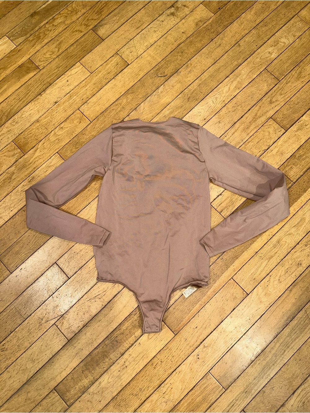 Woman’s Skims long sleeve onesie bodysuit